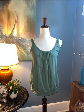 Size M, olive green tankini or workout top. NEW WITH TAGS. Younique.